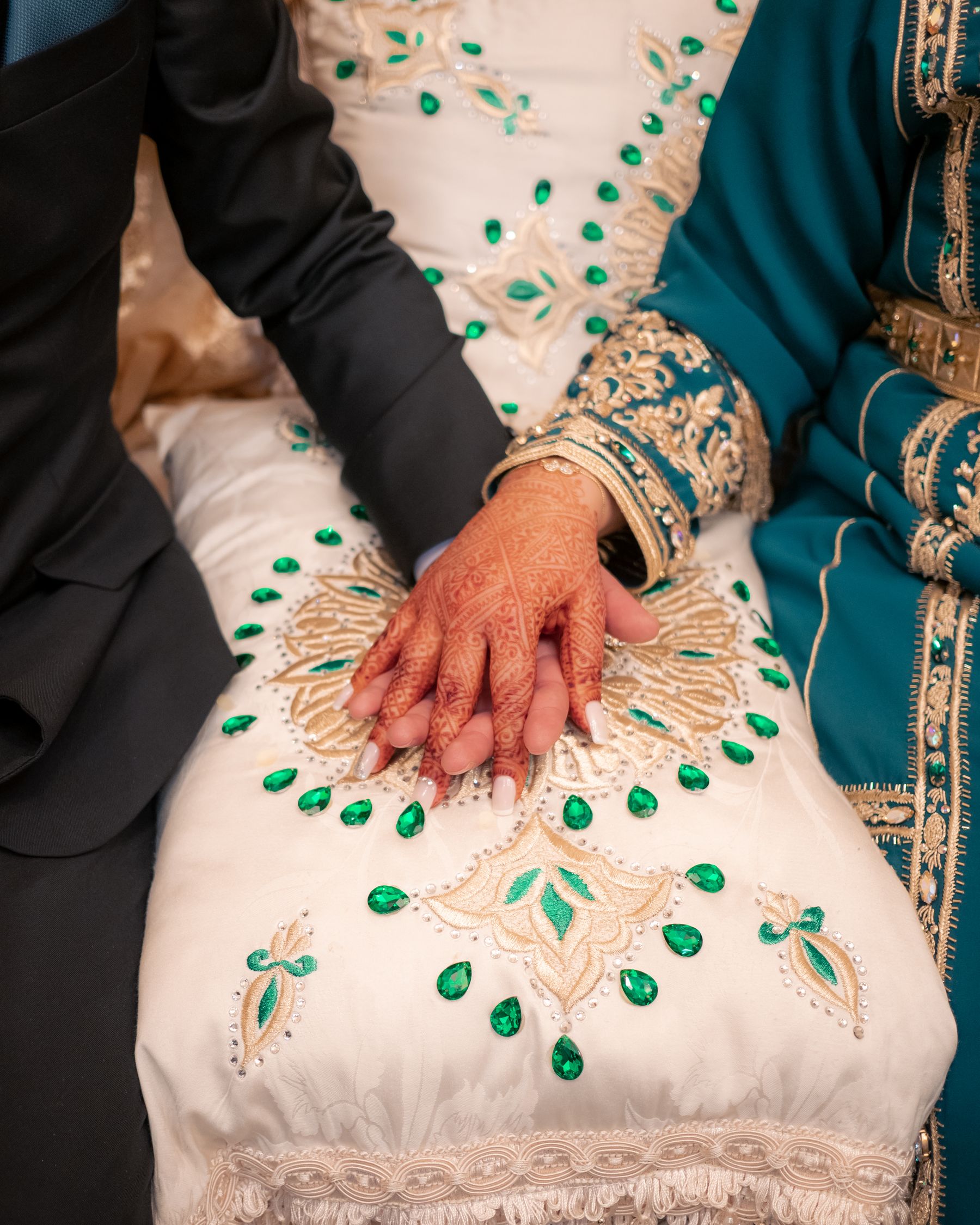 Bride and groom wearing traditional Moroccan wedding attire.